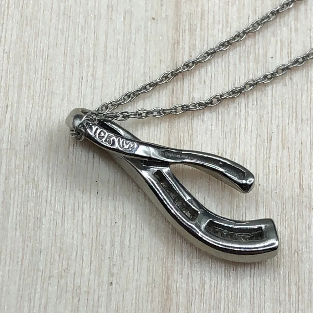 Solid 10k white gold multi baguette diamond wishbone pendant necklace.